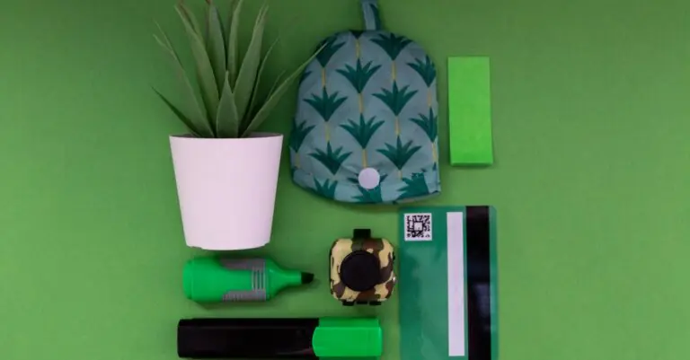 Vibrant green office supplies laid out on a green background, featuring potted plant and bank c - Ki - King Squishy