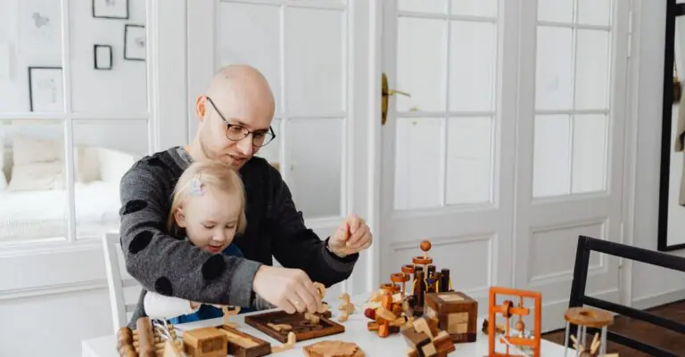 Father and daughter enjoying quality time playing with educational wooden toys indoors. - King Squishy