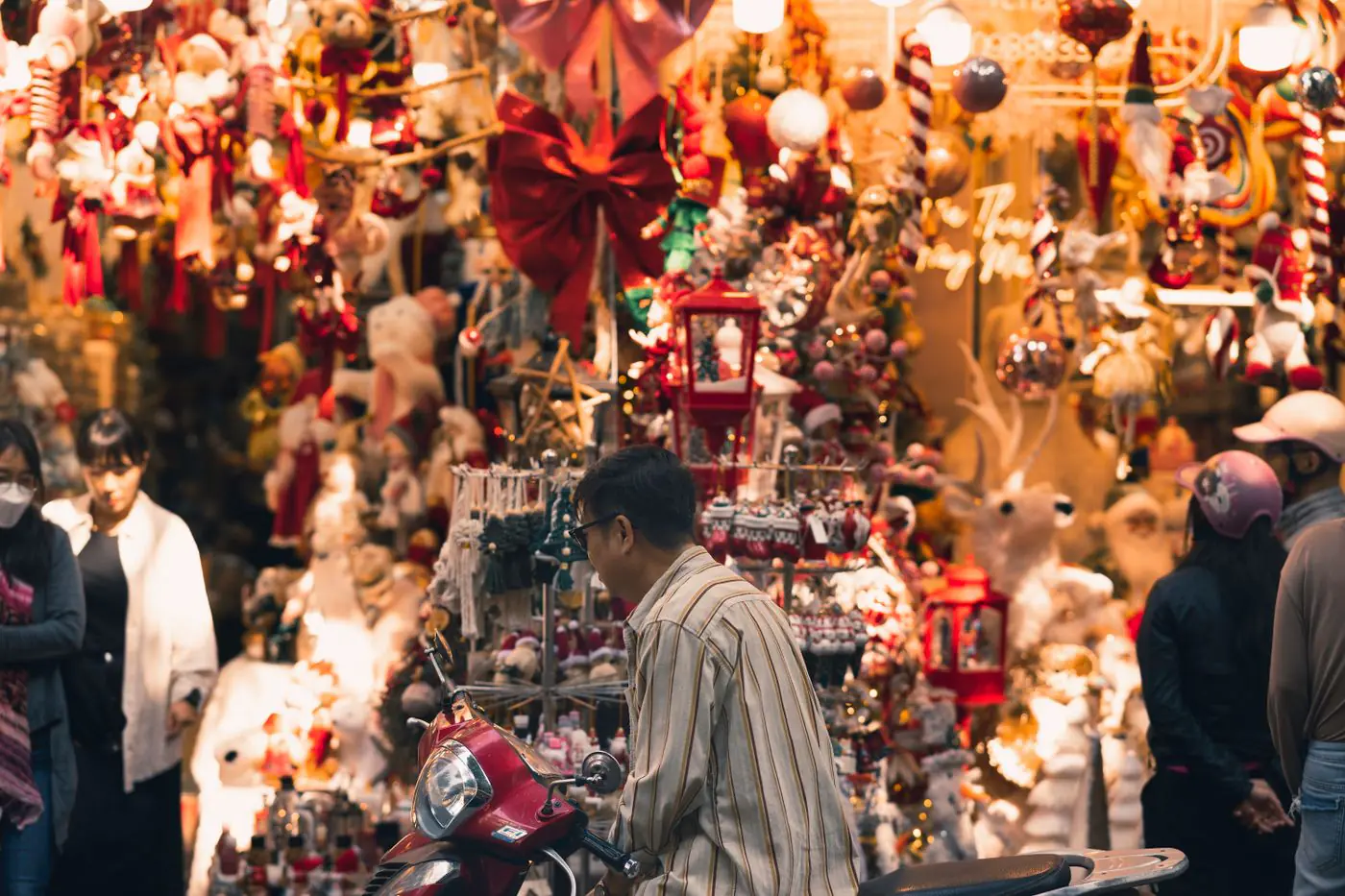 Colorful Christmas market bustling with people and festive decorations, perfect for holiday inspiration. - King Squishy