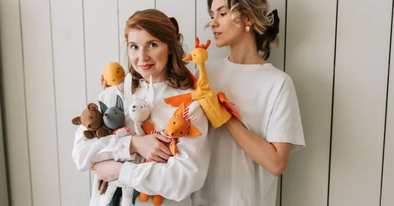 Two joyful women indoors holding assorted colorful plush toys, expressing playful and fun vibes - Ki - King Squishy