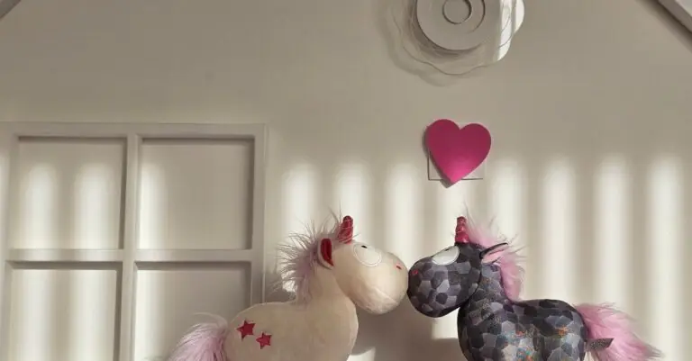 Adorable unicorn plush toys with pink manes on a bright, decorative shelf. - King Squishy - King Squishy