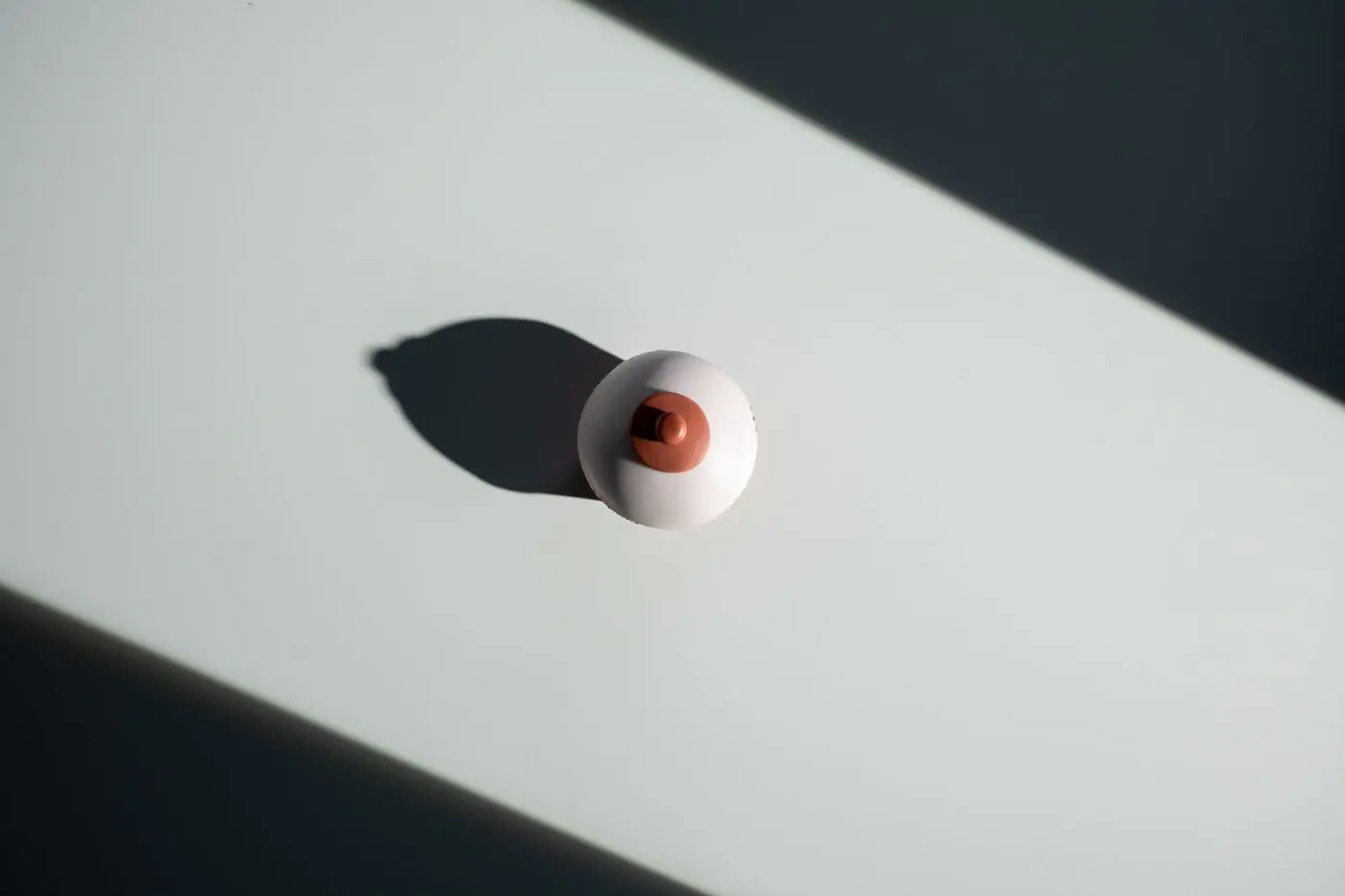 Creative representation of breast cancer awareness with a minimalist style.