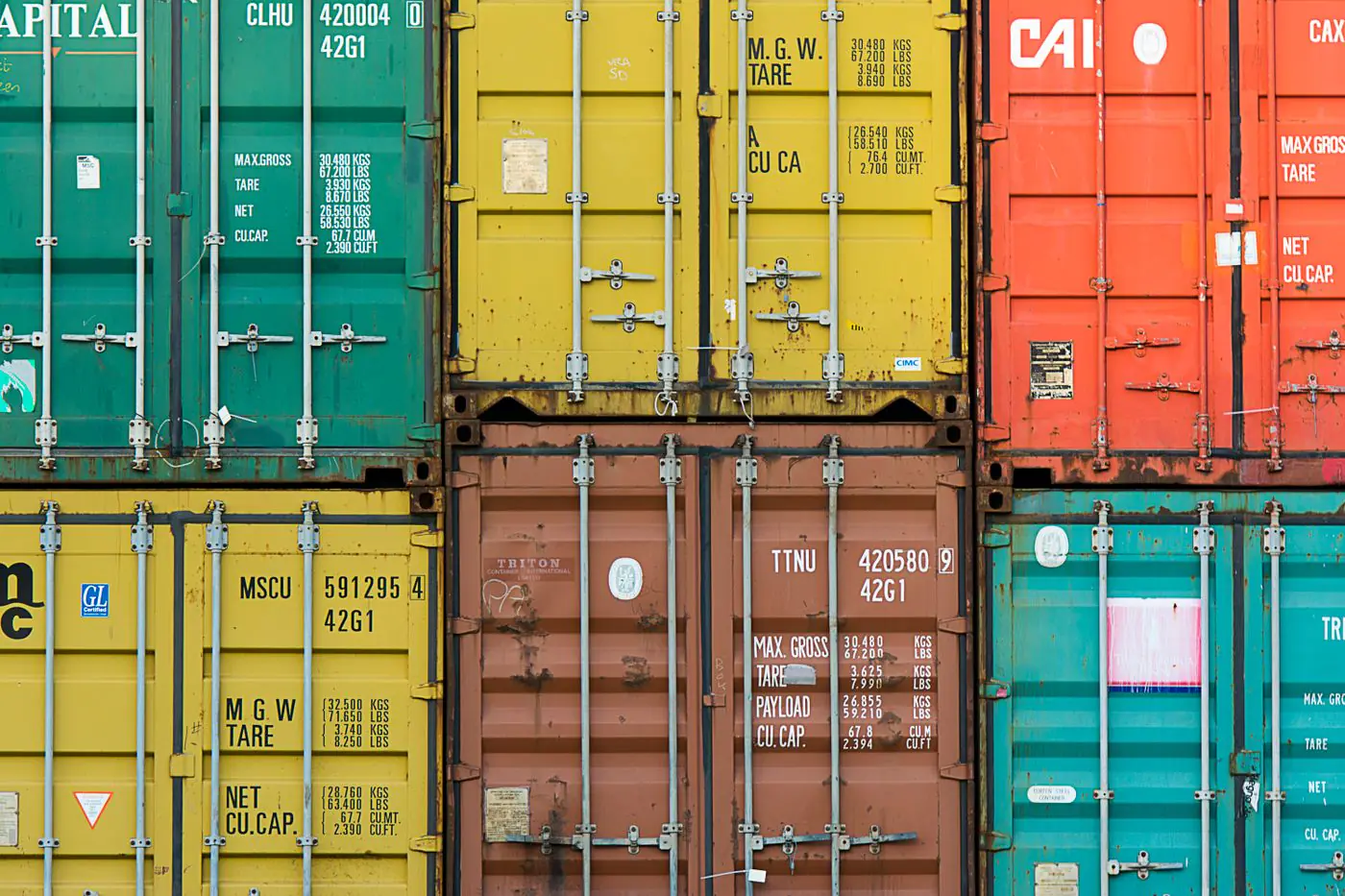 Vibrant cargo containers stacked in a shipping yard highlighting global trade. - King Squishy