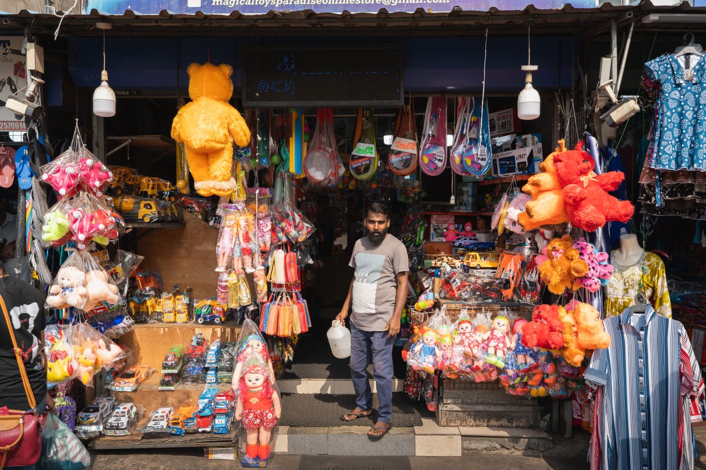 Colorful toy shop in Colombo's bustling Pettah Market, Sri Lanka, showcasing vibrant plush toys and souvenirs. - King Squishy
