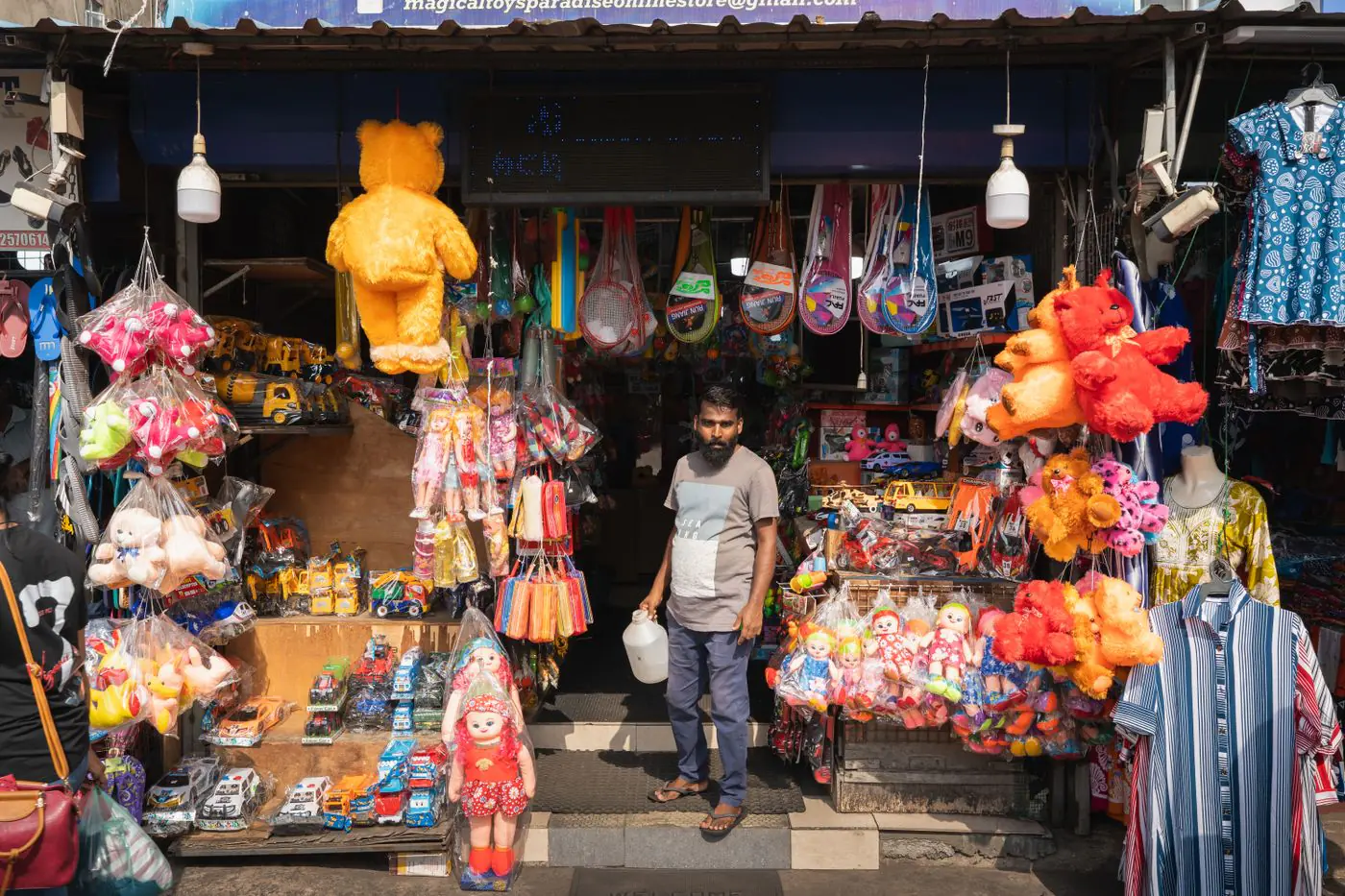 Colorful toy shop in Colombo's bustling Pettah Market, Sri Lanka, showcasing vibrant plush toys and souvenirs. - King Squishy
