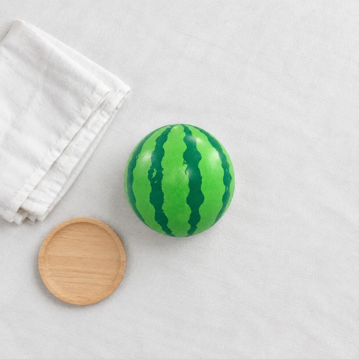 Soft squishy fidget options for dementia care settings arranged on linen - King Squishy